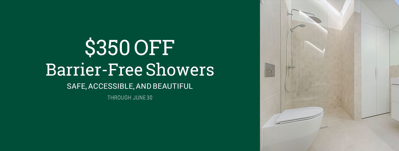 marketing image for $350 OFF Barrier-Free Showers through June 30, 2025 with white text on a green background on the left and an image of a modern bathroom interior with a wall-mounted toilet in the lower left foreground, and a walk-in shower in the background. sunlight streams into the shower stall from a skylight above, clearly showing flat entry into the shower from the bathroom floor