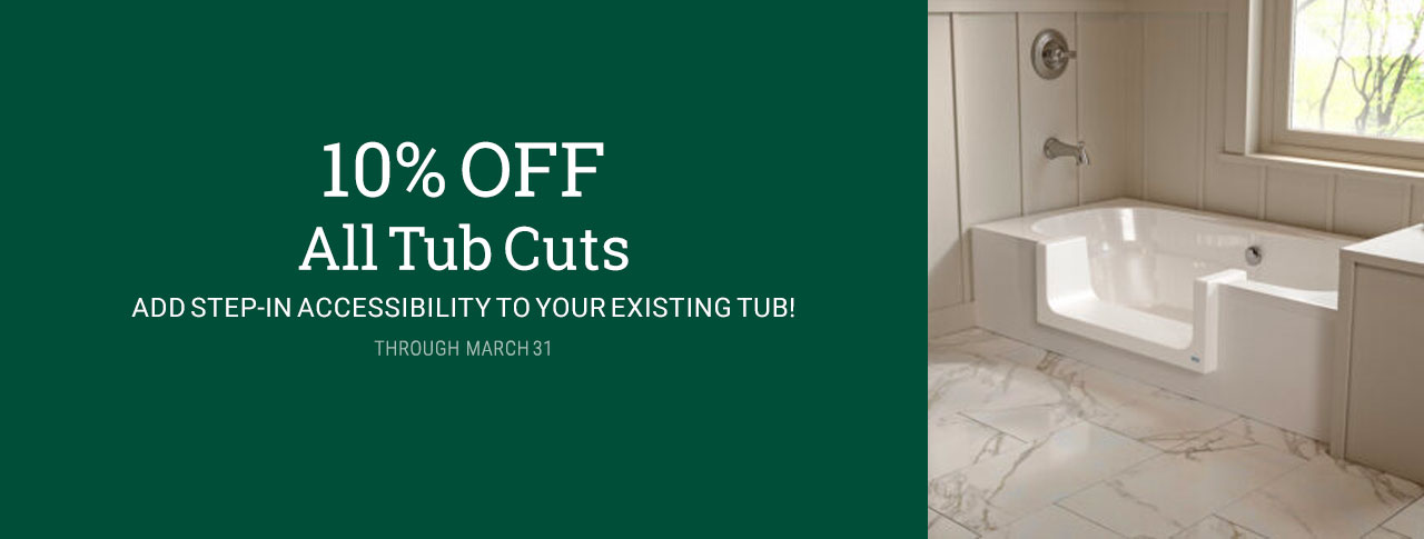 marketing image for 10% OFF all Tub Cuts through March 31, 2025 with white text on a green background on the left and an image of a bright modern farmhouse bathroom with a white with a grey-streaked marble tile floor. The white bath tub is in the center of the photo, with a wide, elegant-looking tub-cut out of the side, so that stepping in or out of the tub is safe and easy