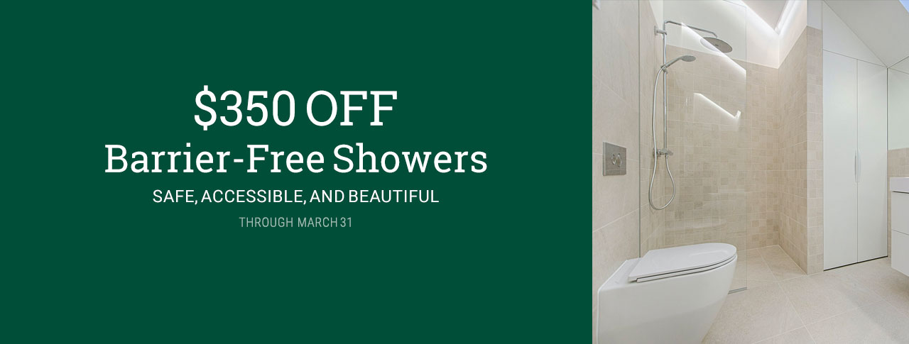 marketing image for $350 OFF Barrier-Free Showers through March 31, 2025 with white text on a green background on the left and an image of a modern bathroom interior with a wall-mounted toilet in the lower left foreground, and a walk-in shower in the background. sunlight streams into the shower stall from a skylight above, clearly showing flat entry into the shower from the bathroom floor